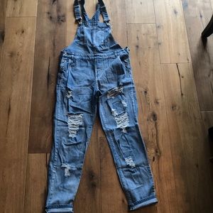 Distressed denim overalls